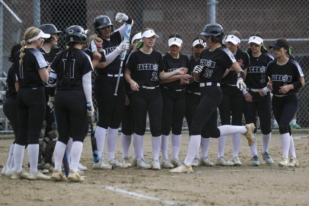 Jackson’s Allie Thomsen (22) celebrates a home run during a prep softball game between Stanwood and Jackson at Henry M. Jackson High School on Tuesday, April 2, 2024 in Mill Creek, Washington. Jackson won, 6-0. (Annie Barker / The Herald)

