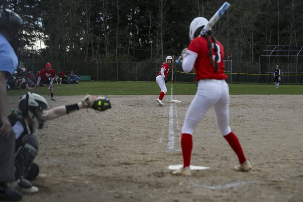 Stanwood’s Madilynn Rel (22) waits on third during a prep softball game between Stanwood and Jackson at Henry M. Jackson High School on Tuesday, April 2, 2024 in Mill Creek, Washington. Jackson won, 6-0. (Annie Barker / The Herald)
