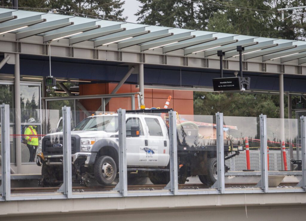 A work truck sits on the tracks at the Mountlake Terrace Light Rail station on Thursday, April 4, 2024 in Mountlake Terrace, Washington. (Olivia Vanni / The Herald)
A work truck is visible on the tracks at the Mountlake Terrace Light Rail station on Thursday, April 4, 2024 in Mountlake Terrace, Washington. (Olivia Vanni / The Herald)

