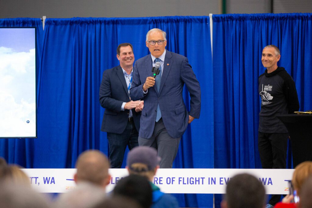 Gov. Jay Inslee speaks to a gathering of employees and others during an event at ZeroAvia’s new Everett facility on Wednesday, April 24, 2024, near Paine Field in Everett, Washington. (Ryan Berry / The Herald)
