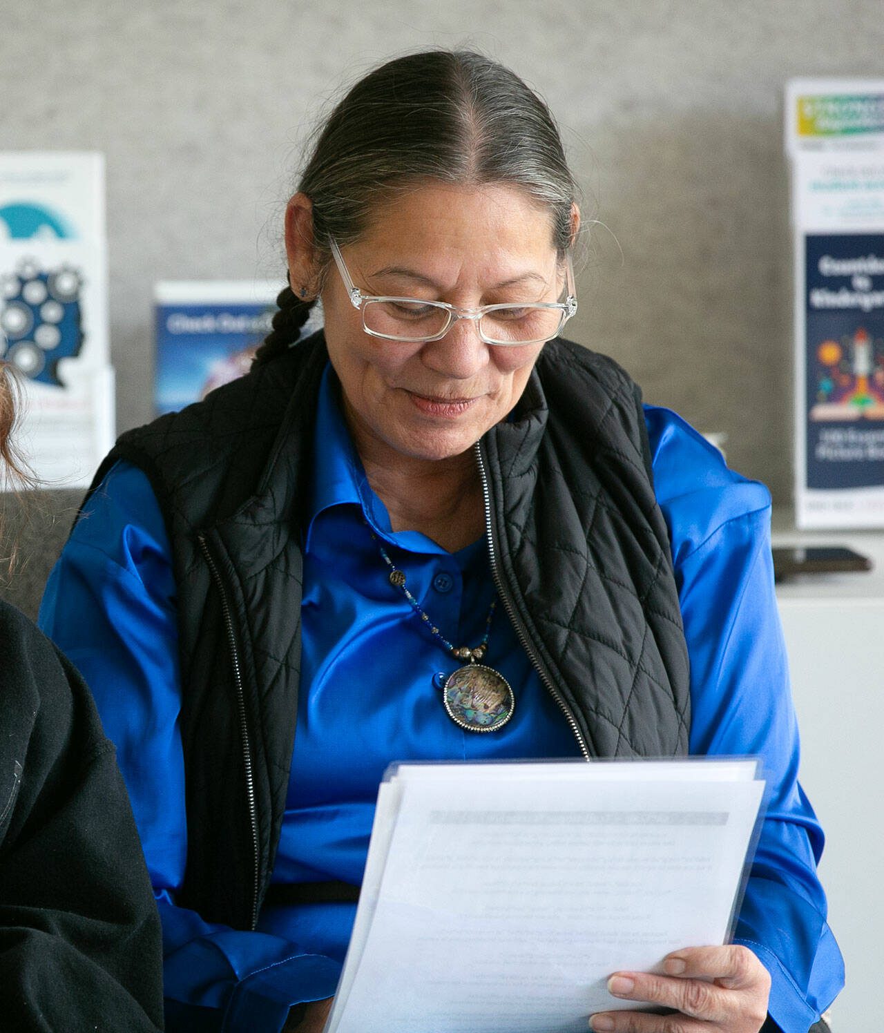 Sauk-Suiattle elder mali reads a traditional Lushootseed story to a group of children and adults Wednesday, April 3, 2024, at the Darrington Public Library in Darrington, Washington. (Ryan Berry / The Herald)