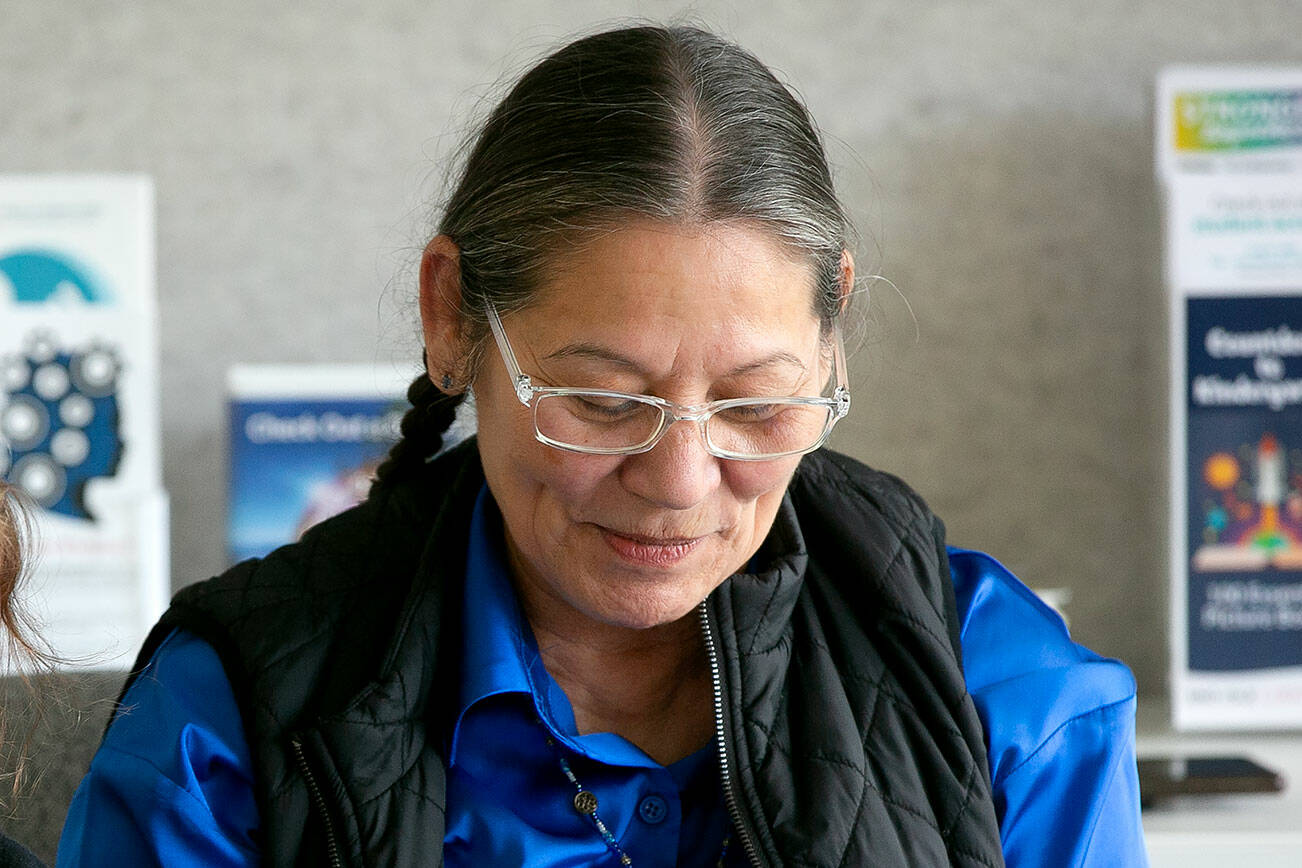 Sauk-Suiattle elder mali reads a traditional Lushootseed story to a group of children and adults Wednesday, April 3, 2024, at the Darrington Public Library in Darrington, Washington. (Ryan Berry / The Herald)