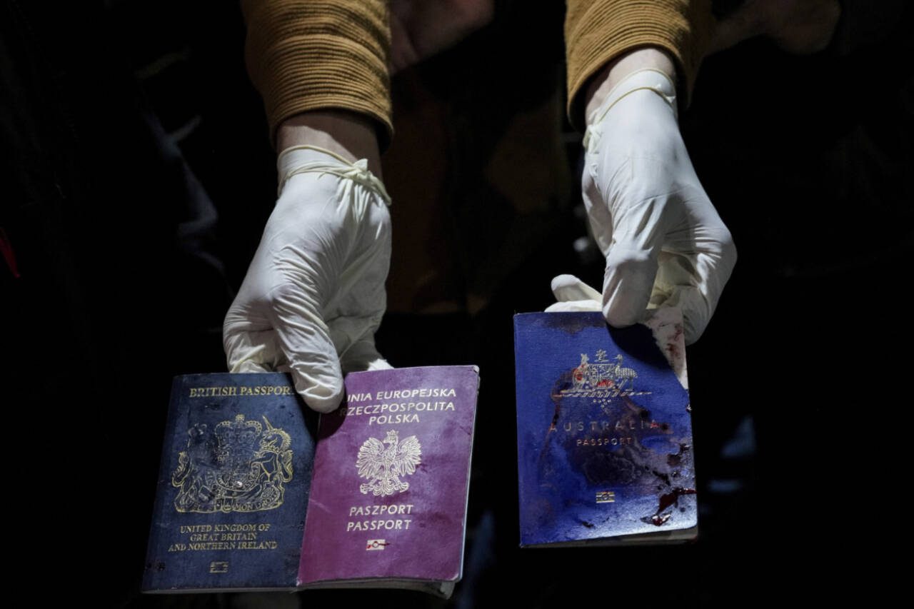 Blood-stained British, Polish and Australian passports of dead aid workers are held for a camera after an Israeli airstrike, in Deir al-Balah, Gaza Strip, April 1. Gaza medical officials said an Israeli airstrike killed international aid workers with the World Central Kitchen charity and their Palestinian drivers after they helped deliver food and other supplies to northern Gaza that had arrived hours earlier by ship. (Abdel Kareem Hana / Associated Press)