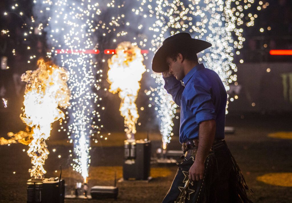 Bull riders walk out into the arena during PBR Everett at Angel of the Winds Arena on Wednesday, April 17, 2024 in Everett, Washington. (Olivia Vanni / The Herald)
