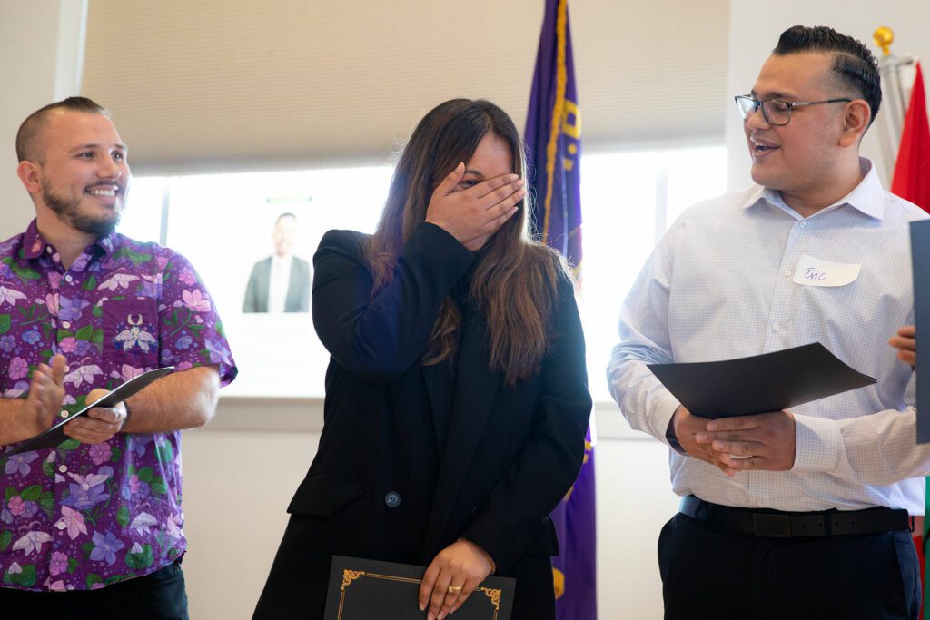 Simreet Dhaliwal covers her face in surprise after being announced the winner during the 2024 Snohomish County Emerging Leaders Awards Presentation on Wednesday, April 17, 2024, in Everett, Washington. (Ryan Berry / The Herald)
