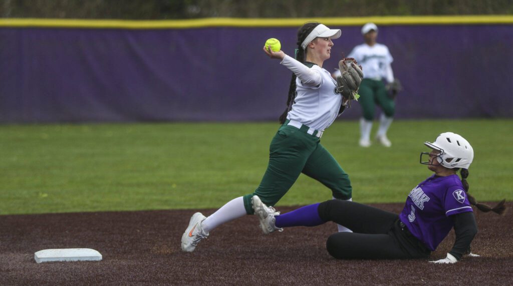 Jackson’s Rachel Sysum (11) gets an out at second during a 4A softball game between Kamiak and Jackson at Kamiak High School on Tuesday, April 9, 2024 in Mukilteo, Washington. Jackson won, 9-0. (Annie Barker / The Herald)
