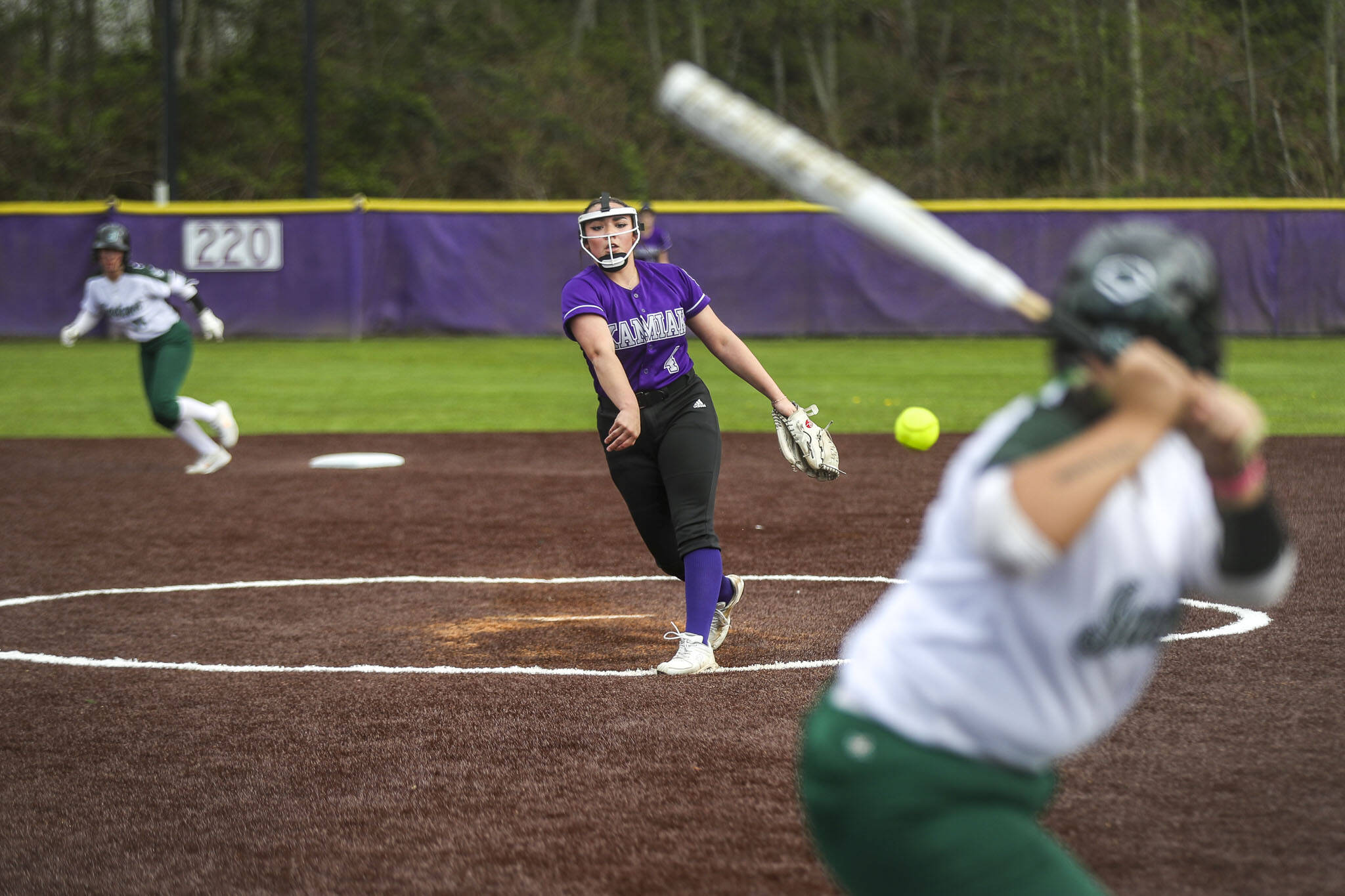 Kamiak’s Ally Boulger (4) pitches during a 4A softball game between Kamiak and Jackson at Kamiak High School on Tuesday, April 9, 2024 in Mukilteo, Washington. Jackson won, 9-0. (Annie Barker / The Herald)