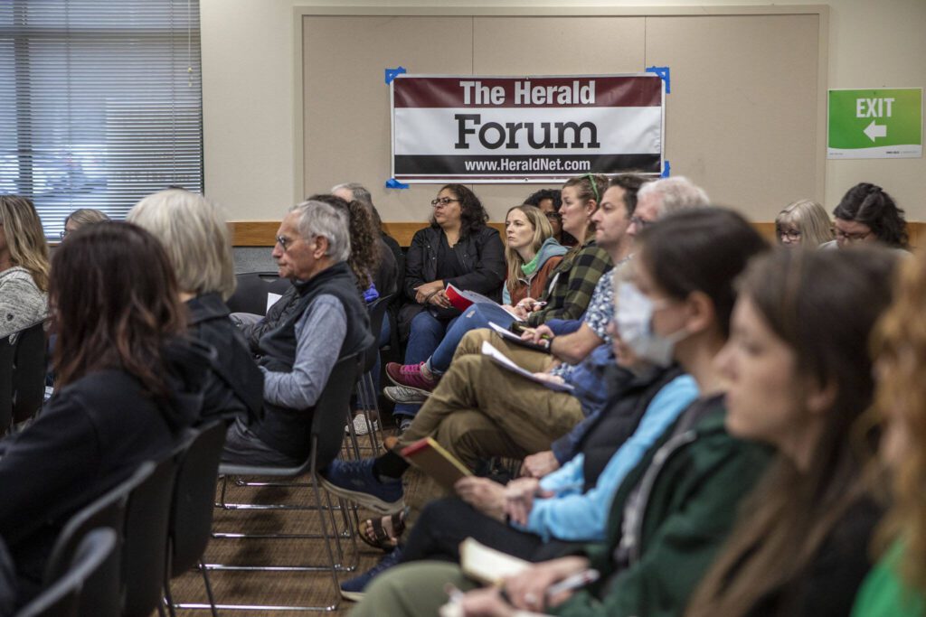 Attendees listen during a homelessness forum sponsored by The Daily Herald at the Mukilteo Library on Thursday, April 11, 2024, in Mukilteo, Washington. (Annie Barker / The Herald)
