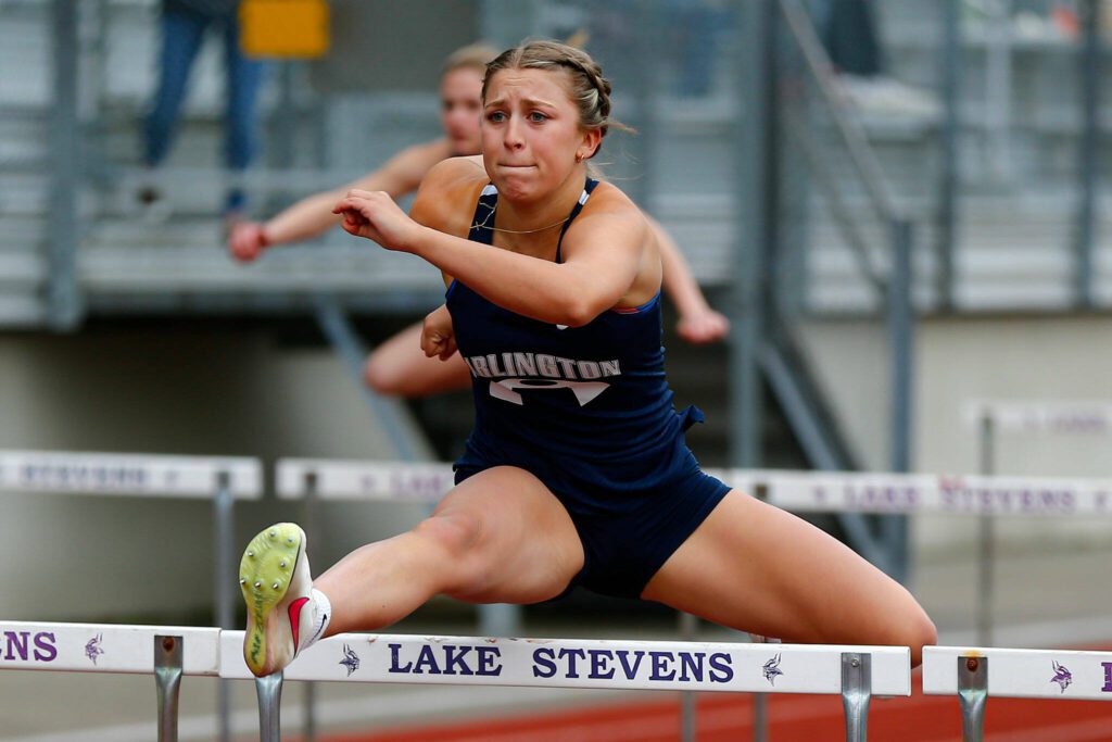 Arlington’s Jersey Walker wins the 100 meter hurdles during a meet Thursday, April 11, 2024, in Lake Stevens, Washington. (Ryan Berry / The Herald)
