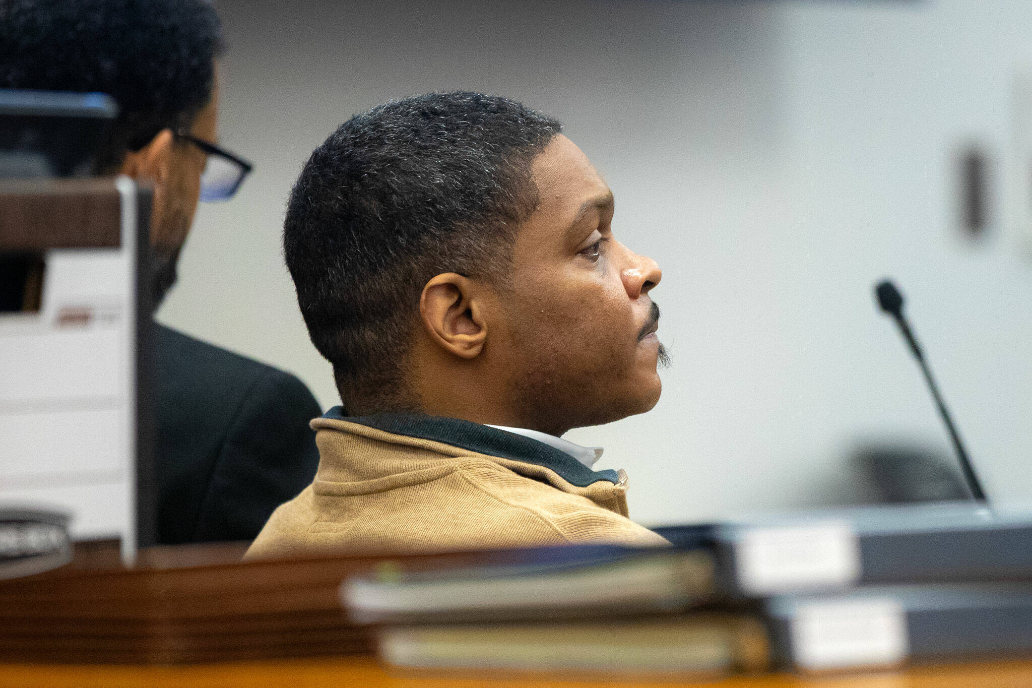 Jamel Alexander, on trial a second time for the 2019 murder of Shawna Brune, listens to his defense give opening statements on Tuesday, April 16, 2024, at Snohomish County Superior Court in Everett, Washington. (Ryan Berry / The Herald)