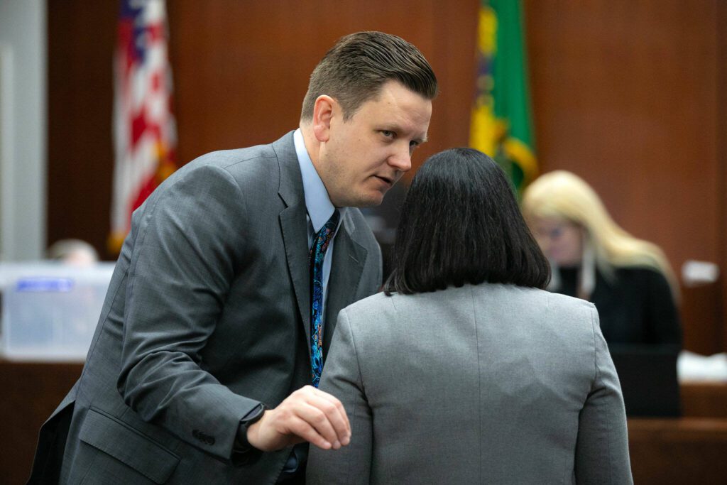 Deputy prosecutors Bob Langbehn and Melissa Samp speak during the new trial of Jamel Alexander on Tuesday, April 16, 2024, at Snohomish County Superior Court in Everett, Washington. (Ryan Berry / The Herald)
