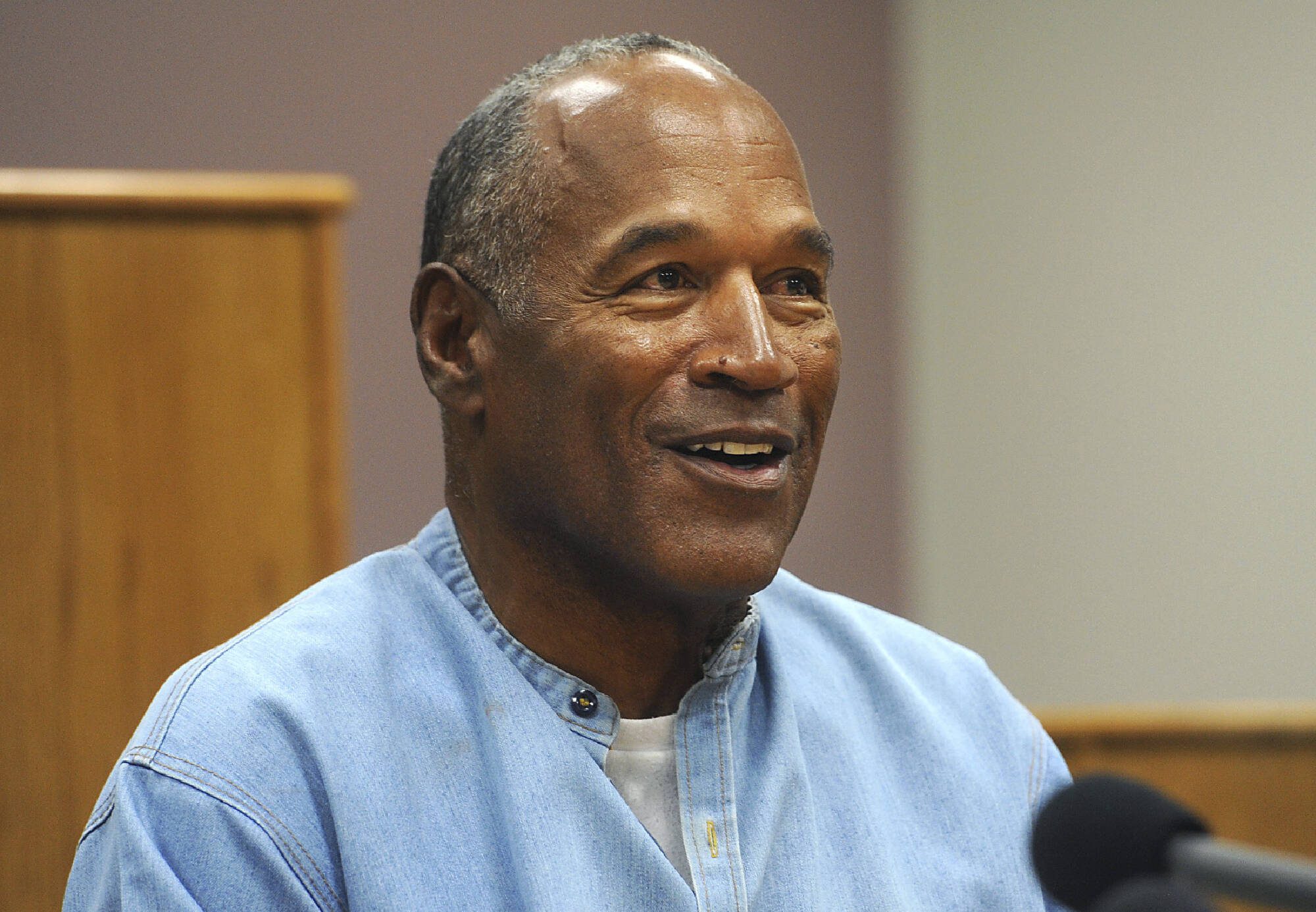 Former NFL football star O.J. Simpson appears via video for his parole hearing at the Lovelock Correctional Center in Lovelock, Nev., on July 20, 2017. Simpson, the decorated football superstar and Hollywood actor who was acquitted of charges he killed his former wife and her friend but later found liable in a separate civil trial, has died. He was 76. (Jason Bean/The Reno Gazette-Journal via AP, Pool, File)