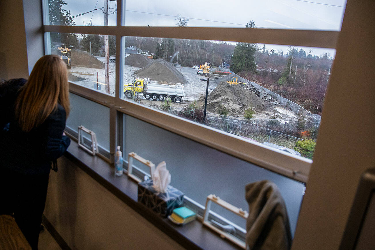 People look out onto Mountain Loop Mine from the second floor hallway of Fairmount Elementary on Wednesday, Jan. 10, 2024 in Everett, Washington. (Olivia Vanni / The Herald)