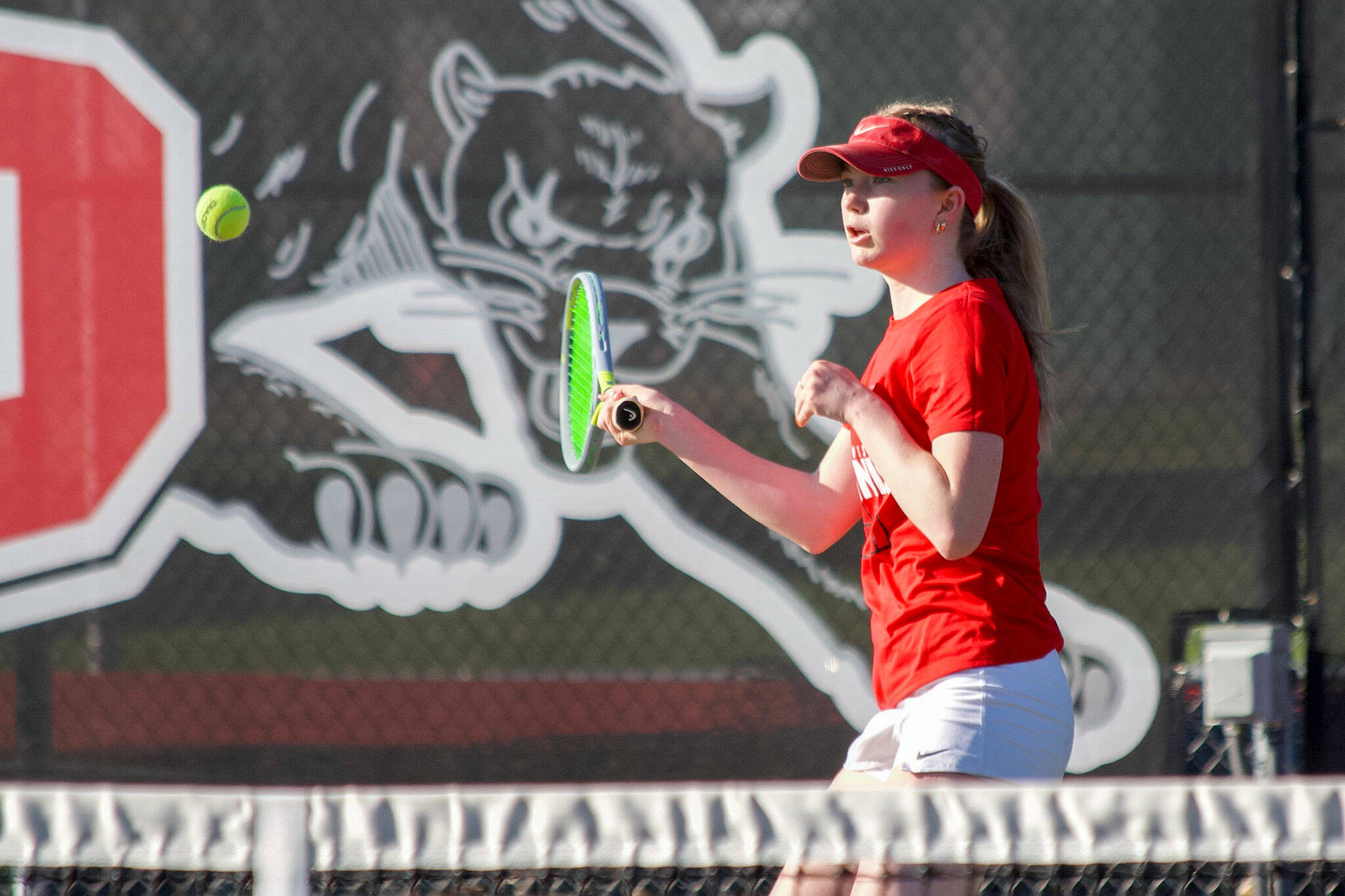Snohomish’s Morgan Gibson returns the ball in her match against Stanwood’s Ryann Reep on Friday, April 12, 2024 in Snohomish, Washington. Gibson lost the first set 4-6 but rallied back to win 6-2 in the second and 6-0 in the third. The Panthers bested the Spartans 5-2. (Taras McCurdie / The Herald)