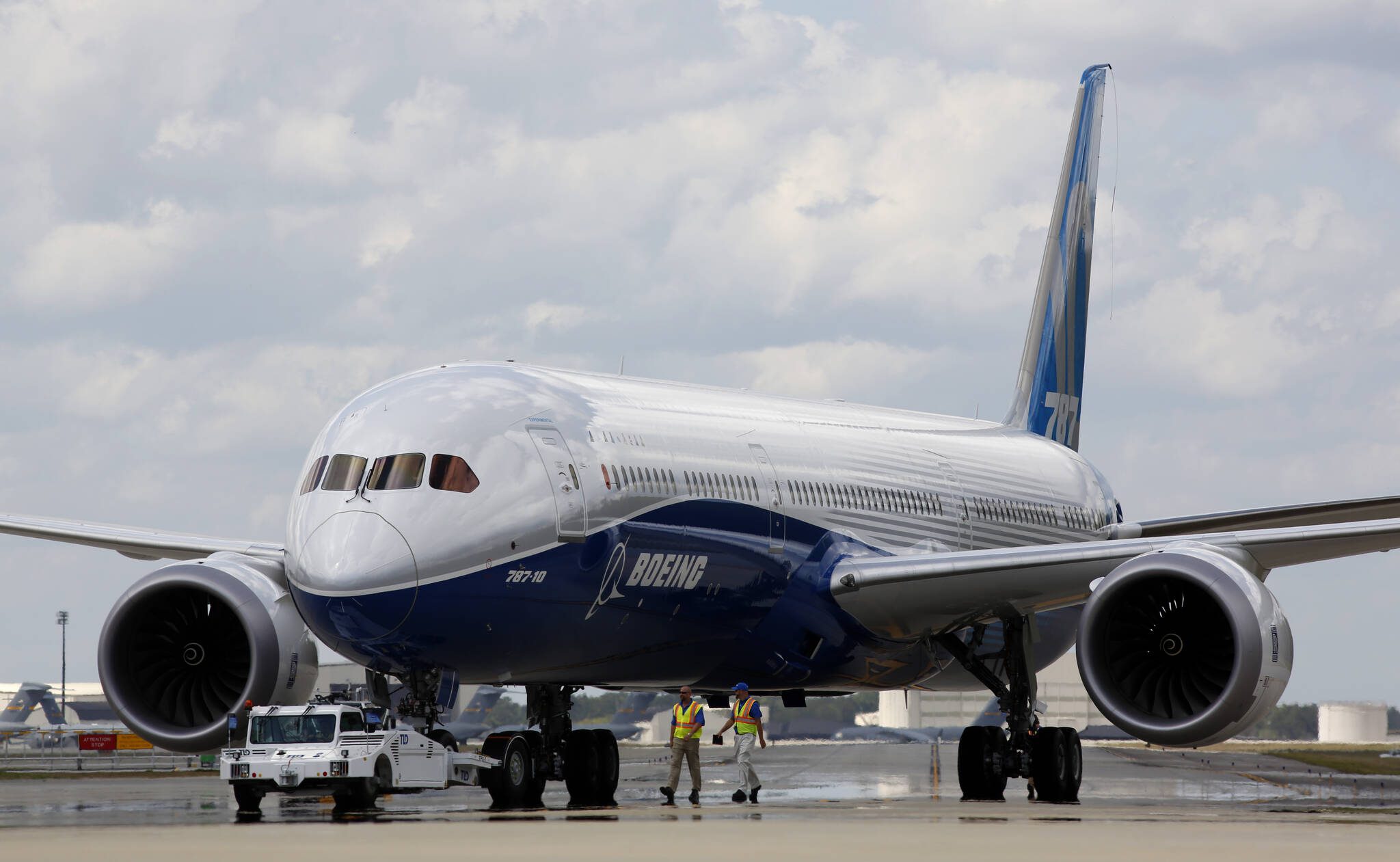 Boeing employees walk by a Boeing 787-10 Dreamliner at the company’s facility in South Carolina after conducting its first test flight at Charleston International Airport in North Charleston, South Carolina in 2017. (AP Photo/Mic Smith, File)