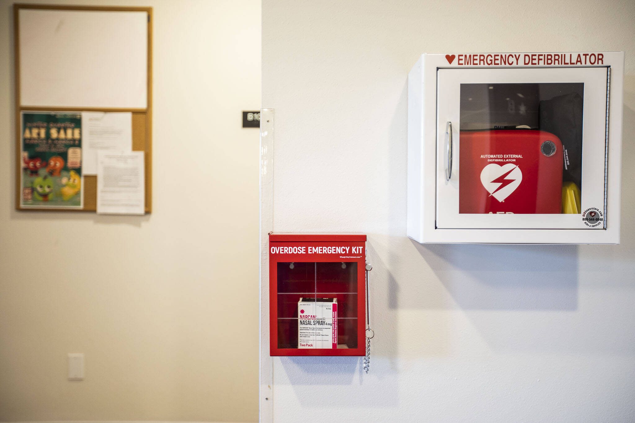 An emergency overdose kit with naloxone located next to an emergency defibrillator at Mountain View student housing at Everett Community College on Tuesday, March 5, 2024 in Everett, Washington. (Olivia Vanni / The Herald)