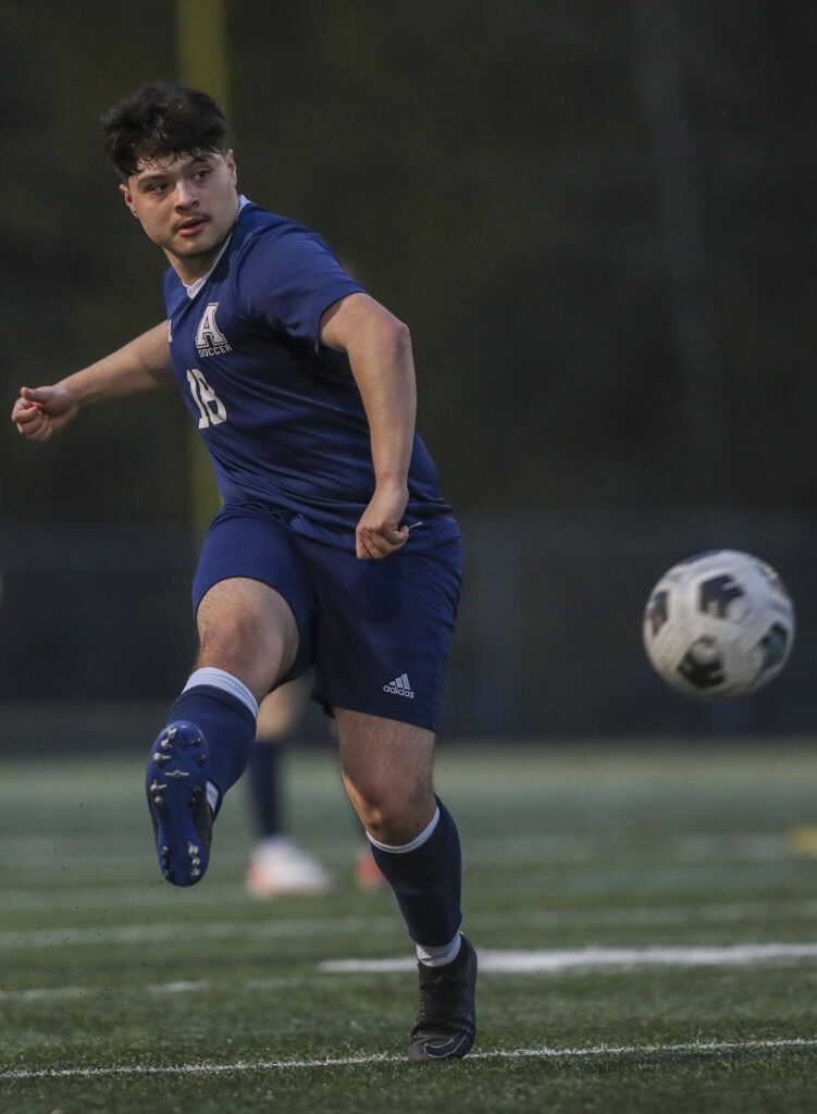 Arlington’s Brian Torres (18) kicks the ball during a boys soccer game between Archbishop Murphy and Arlington at Arlington High School on Monday, April 15, 2024 in Arlington, Washington. (Annie Barker / The Herald)
