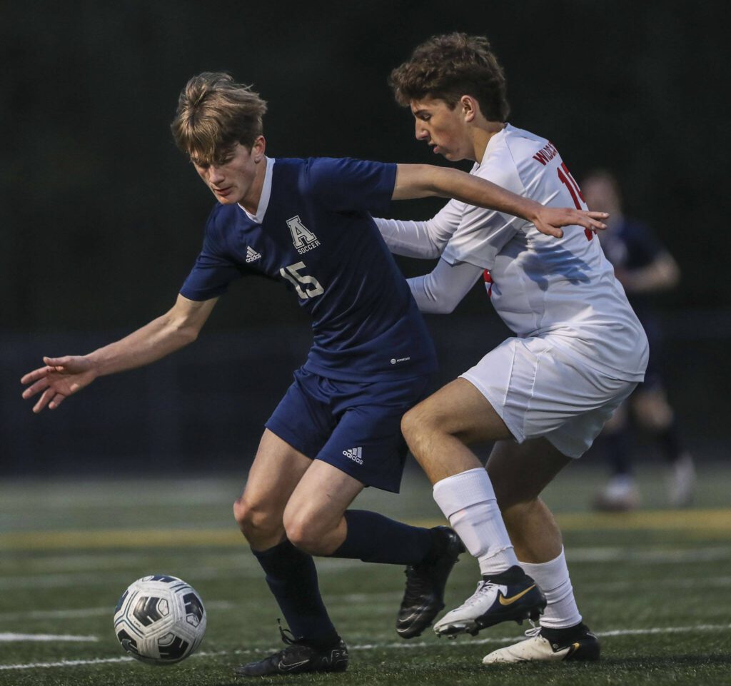 Arlington’s Scott Rutherford (15) moves with the ball during a boys soccer game between Archbishop Murphy and Arlington at Arlington High School on Monday, April 15, 2024 in Arlington, Washington. (Annie Barker / The Herald)
