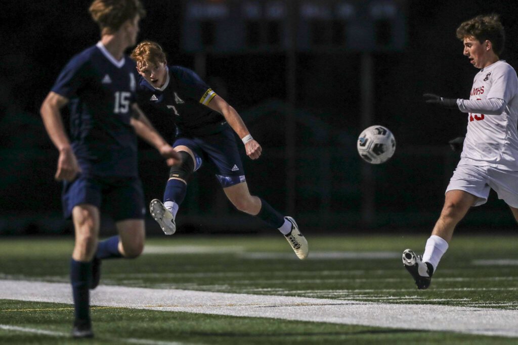 Arlington’s Aidan Raney (7) kicks the ball during a boys soccer game between Archbishop Murphy and Arlington at Arlington High School on Monday, April 15, 2024 in Arlington, Washington. (Annie Barker / The Herald)
