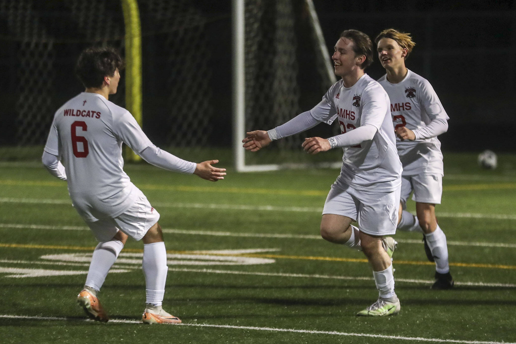 Archbishop Murphy players celebrate during a boys soccer game between Archbishop Murphy and Arlington at Arlington High School on Monday, April 15, 2024 in Arlington, Washington. (Annie Barker / The Herald)