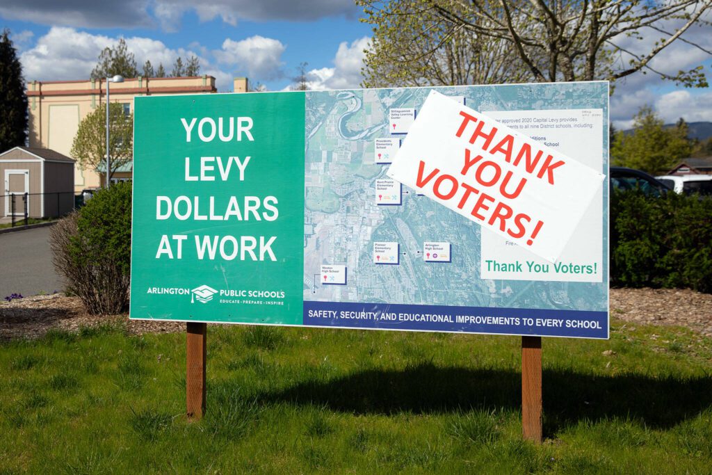 A sign thanks Arlington voters for approving a 2020 levy on Tuesday, April 16, 2024, in Arlington, Washington. (Ryan Berry / The Herald)
