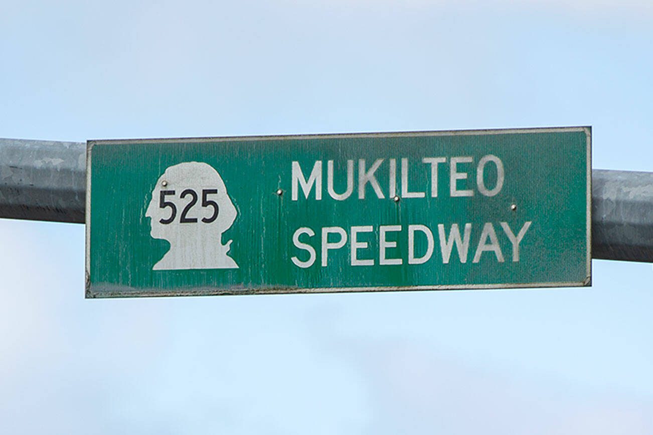 A Mukilteo Speedway sign hangs at an intersection along the road on Sunday, April 21, 2024, in Mukilteo, Washington. (Ryan Berry / The Herald)