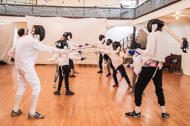 Bob Tearse, left, and Joseph Kleinman spar alongside students during a fencing class they teach at Bayview Community Hall in Langley. (Luisa Loi / Whidbey News-Times)

