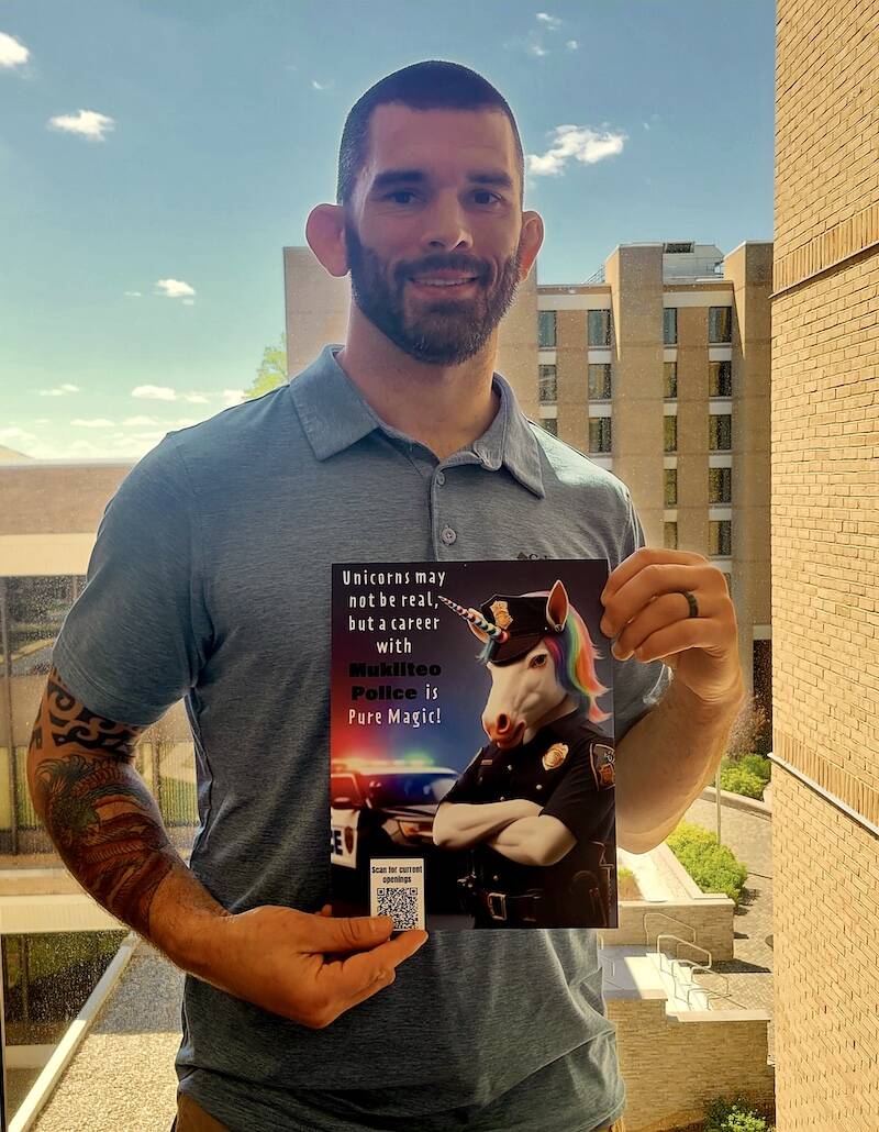 Mukilteo Police Chief Andy Illyn holding the graphic he created. He is currently attending the 10-week FBI National Academy in Quantico, Virginia. (Photo provided by Andy Illyn)