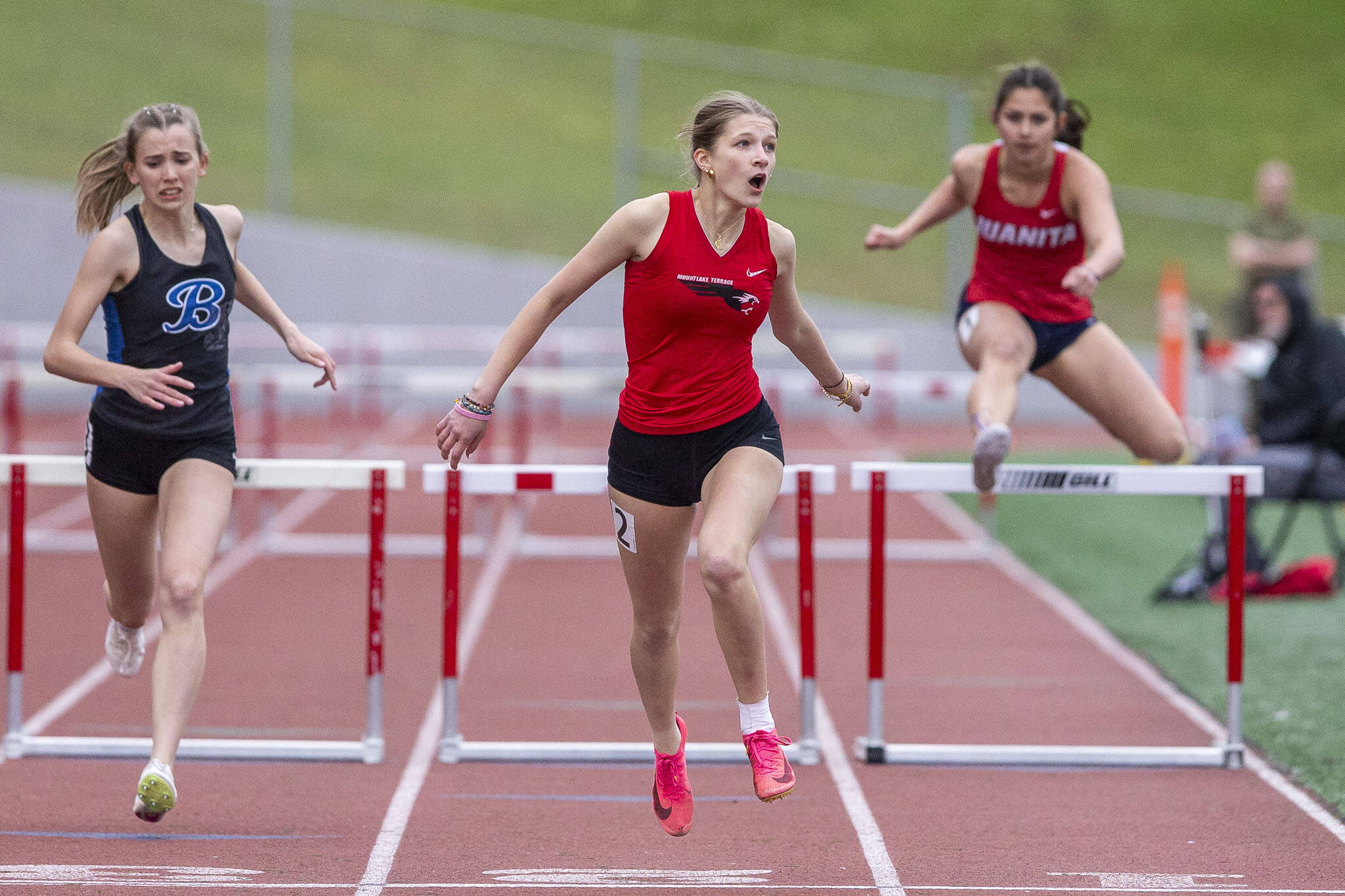 Mountlake Terrace’s Brynlee Dubiel reacts to her time after crossing the finish line in the girls 300-meter hurdles during the Eason Invitational at Snohomish High School on Saturday, April 20, 2024 in Snohomish, Washington. Dubiel placed fourth with a time of 46.85 seconds. (Olivia Vanni / The Herald)