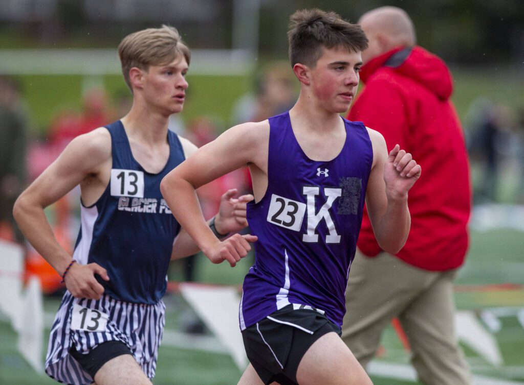 Kamiak’s Cole Henriksen runs in the boys 3,200 meters followed by Glacier Peak’s Mason Strasser during the Eason Invitational at Snohomish High School on Saturday, April 20, 2024 in Snohomish, Washington. (Olivia Vanni / The Herald)
