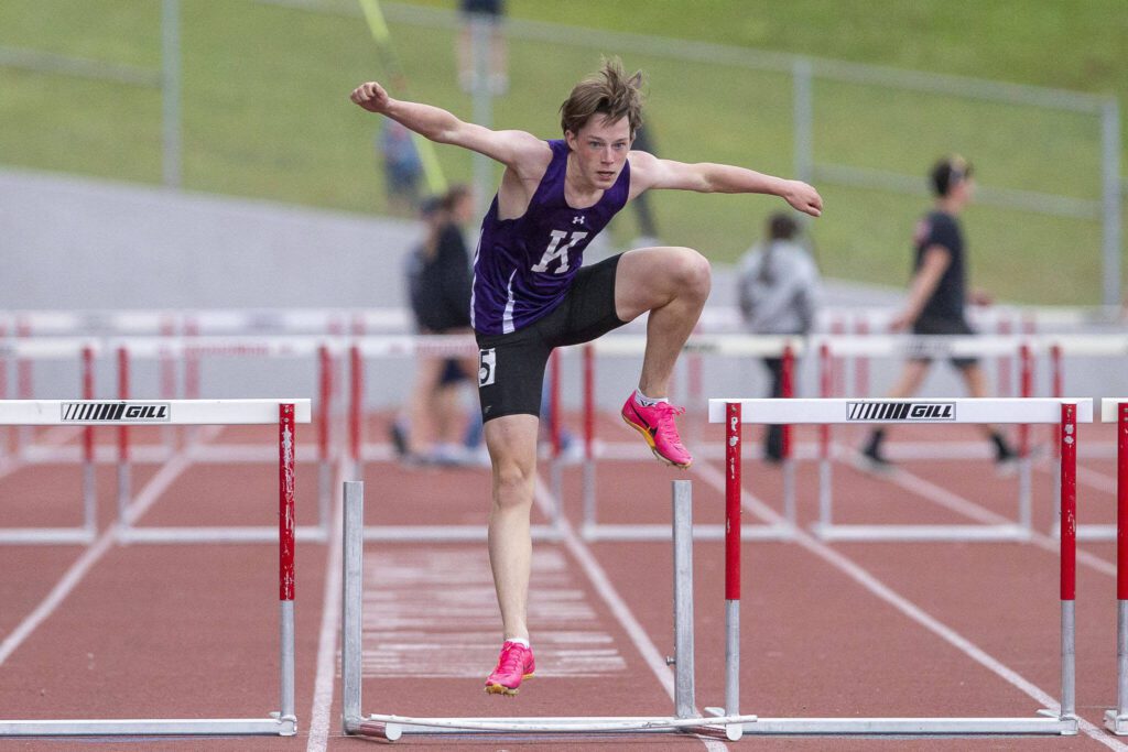 Kamiak’s Miller Warme knocks over the final hurdle before crossing the finish line in the boys 300-meter hurdles during the Eason Invitational at Snohomish High School on Saturday, April 20, 2024 in Snohomish, Washington. (Olivia Vanni / The Herald)
