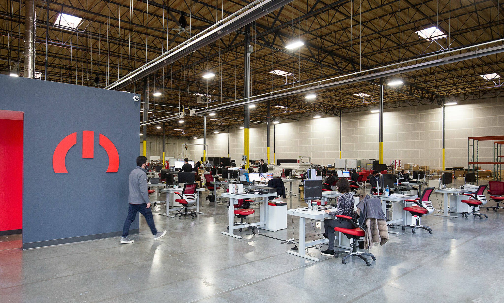 magniX employees and staff have moved into the companys new 40,000 square foot office on Seaway Boulevard on Monday, Jan. 18, 2020 in Everett, Washington. magniX consolidated all of its Australia and Redmond operations under one roof to be home to the global headquarters, engineering, manufacturing and testing of its electric propulsion systems. (Andy Bronson / The Herald)