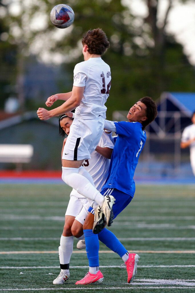 Cascade midfielder Carter Gay heads the ball away from Shorewood during a boys soccer match on Monday, April 22, 2024, at Shoreline Stadium in Shoreline, Washington. (Ryan Berry / The Herald)
