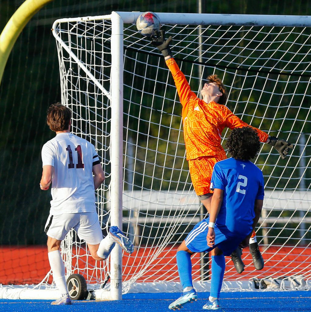 Cascade goaltender Ethan Frausto narrowly evades a Shorewood goal as the ball goes off the post during a boys soccer match on Monday, April 22, 2024, at Shoreline Stadium in Shoreline, Washington. (Ryan Berry / The Herald)
