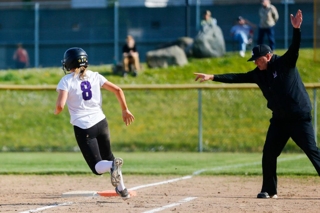 Lake Stevens’ Zoe Hopkins makes a turn a first base on hr way to a double against Glacier Peak on Tuesday, April 23, 2024, at Glacier Peak High School in Snohomish, Washington. (Ryan Berry / The Herald)

