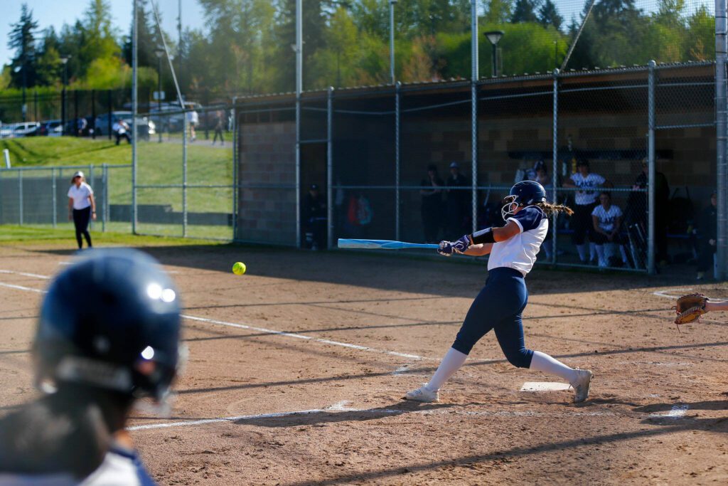 Glacier Peak’s Sammie Christensen advances a runner with a ground ball against Lake Stevens on Tuesday, April 23, 2024, at Glacier Peak High School in Snohomish, Washington. (Ryan Berry / The Herald)

