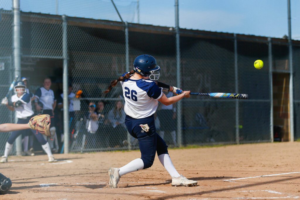 Glacier Peak’s Lauren Hufford makes contact with a pitch against Lake Stevens on Tuesday, April 23, 2024, at Glacier Peak High School in Snohomish, Washington. (Ryan Berry / The Herald)
