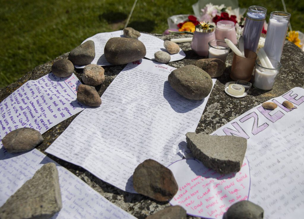 Notes cover the top of a rock set up as a memorial for Jenzele Couassi on Tuesday, April 23, 2024 in Tulalip, Washington. (Olivia Vanni / The Herald)
