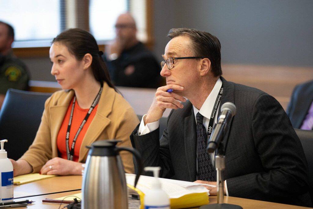Deputy prosecutors Sarah Johnson and Craig Matheson work during the sentencing of Alan Edward Dean on Wednesday, April 24, 2024, at Snohomish County Superior Court in Everett, Washington. (Ryan Berry / The Herald)
