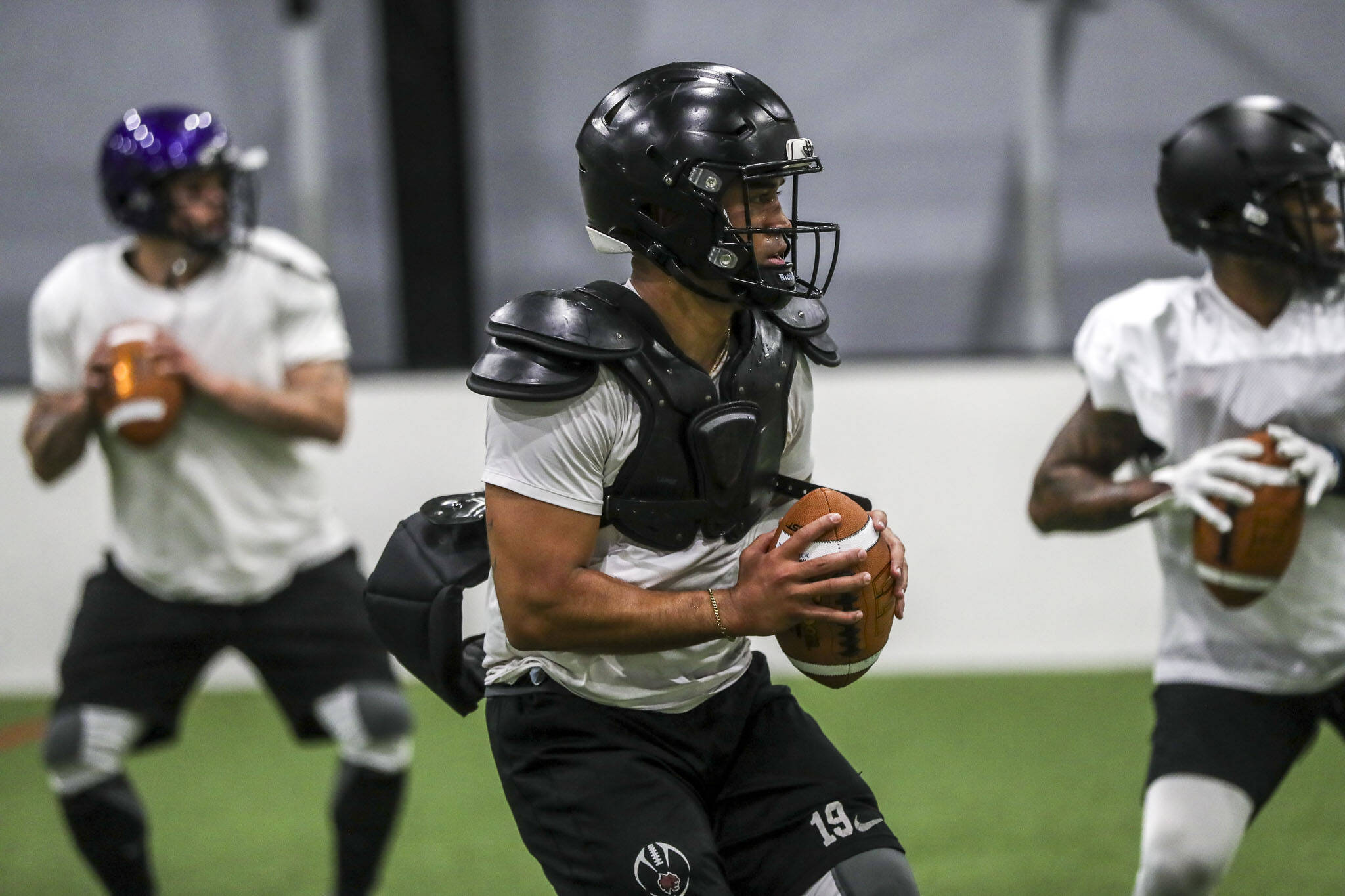 Players run drills during a Washington Wolfpack of the AFL training camp at the Snohomish Soccer Dome on Wednesday, April 10, 2024 in Snohomish, Washington. (Annie Barker / The Herald)