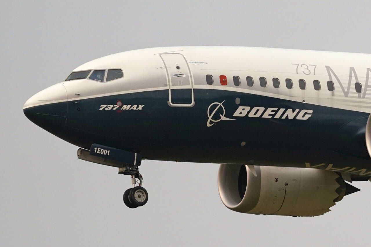 A Boeing 737 Max jet prepares to land at Boeing Field following a test flight in Seattle, Sept. 30, 2020. (AP Photo/Elaine Thompson, File)