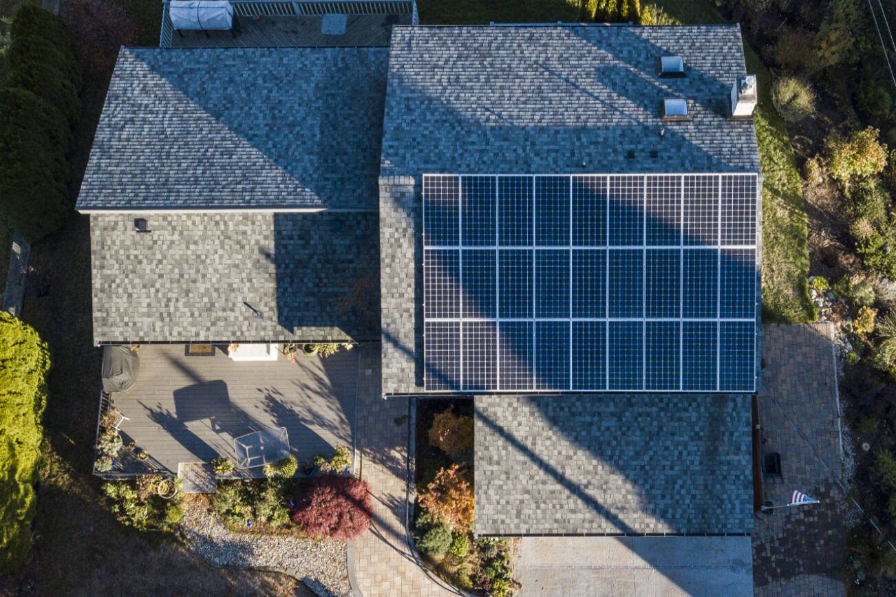 Solar panels are visible along the rooftop of the Crisp family home on Monday, Nov. 14, 2022 in Everett, Washington. (Olivia Vanni / The Herald)