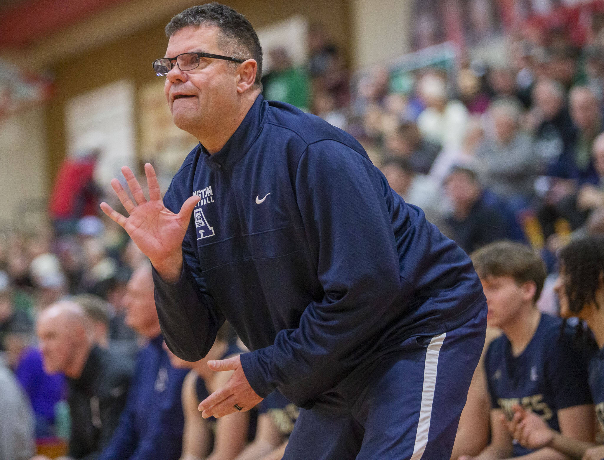 Arlington head coach Nick Brown calls a play during the game against Mount Vernon on Tuesday, Feb. 13, 2024 in Marysville, Washington. (Olivia Vanni / The Herald)