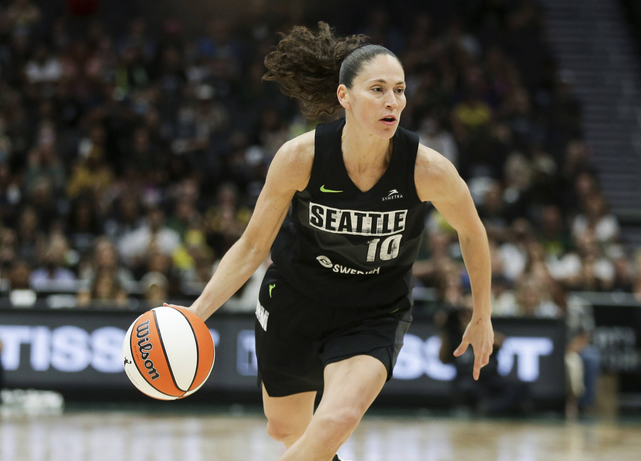 Seattle Storm guard Sue Bird brings the ball up against the Washington Mystics during the second half of Game 1 of a WNBA basketball first-round playoff series Aug. 18, 2022, in Seattle. The Storm’s owners, Force 10 Hoops, said Wednesday that Bird has joined the ownership group. (AP Photo/Lindsey Wasson, File)