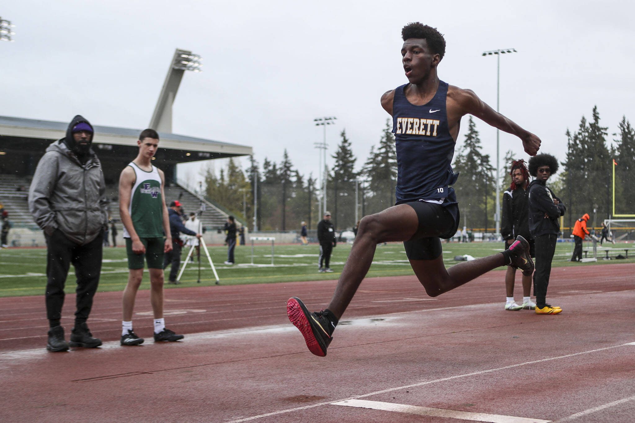 Everett’s Shukurani Ndayiragije participates in the triple jump event during a track meet between Lynnwood, Everett, and Edmonds-Woodway at Edmonds District Stadium on Thursday, April 25, 2024 in Edmonds, Washington. (Annie Barker / The Herald)