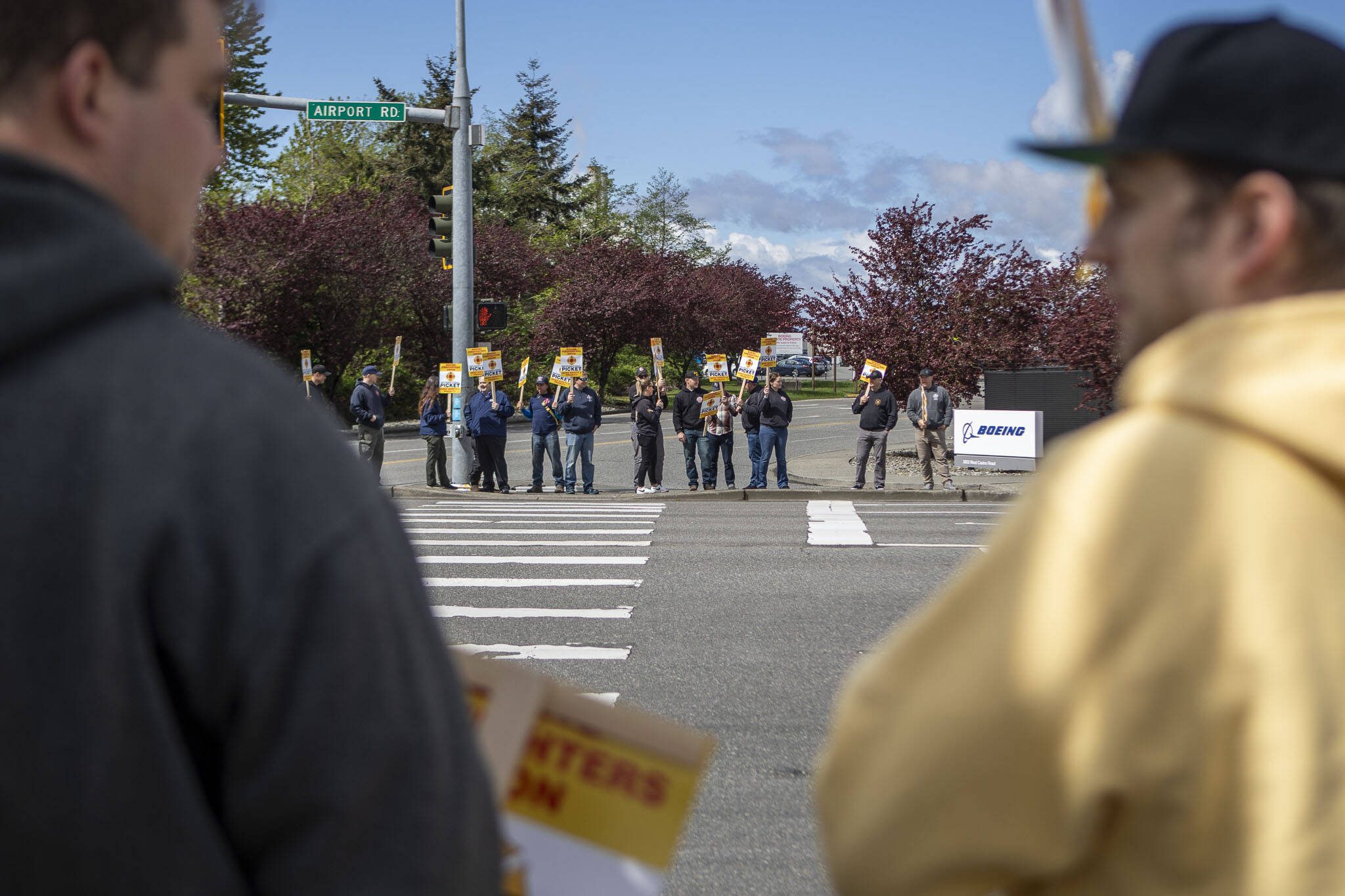 Members of Boeing’s firefighter union and supporters hold an informational picket at Airport Road and Kasch Park Road on Monday, April 29, 2024 in Everett, Washington. (Annie Barker / The Herald)