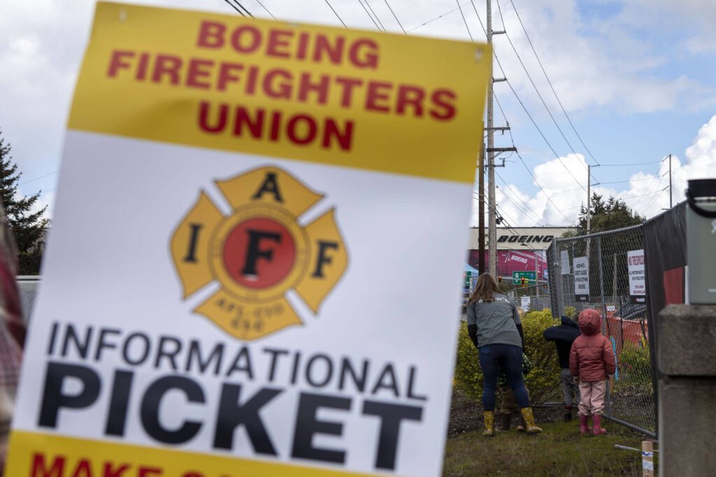 Members of Boeing’s firefighter union and supporters hold an informational picket at Airport Road and Kasch Park Road on Monday, April 29, 2024 in Everett, Washington. (Annie Barker / The Herald)
