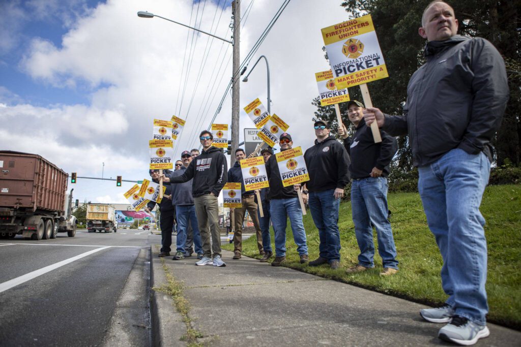Members of Boeing’s firefighter union and supporters hold an informational picket at Airport Road and Kasch Park Road on Monday, April 29, 2024 in Everett, Washington. (Annie Barker / The Herald)
