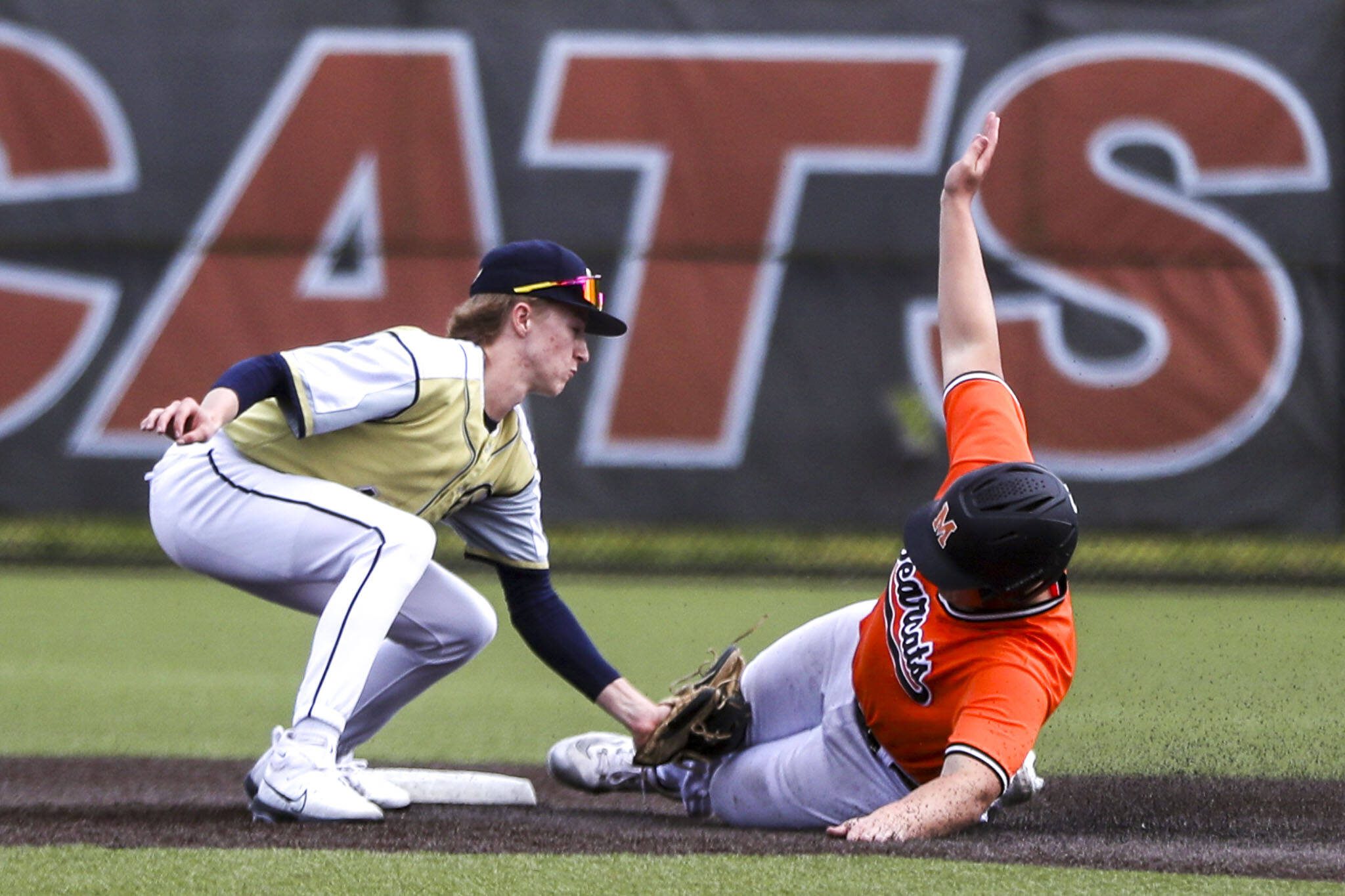 Monroe’s Brennan Sheppard (8) slides into second during a baseball game between Monroe and Arlington at Monroe High School on Friday, April 26, 2024 in Monroe, Washington. (Annie Barker / The Herald)
