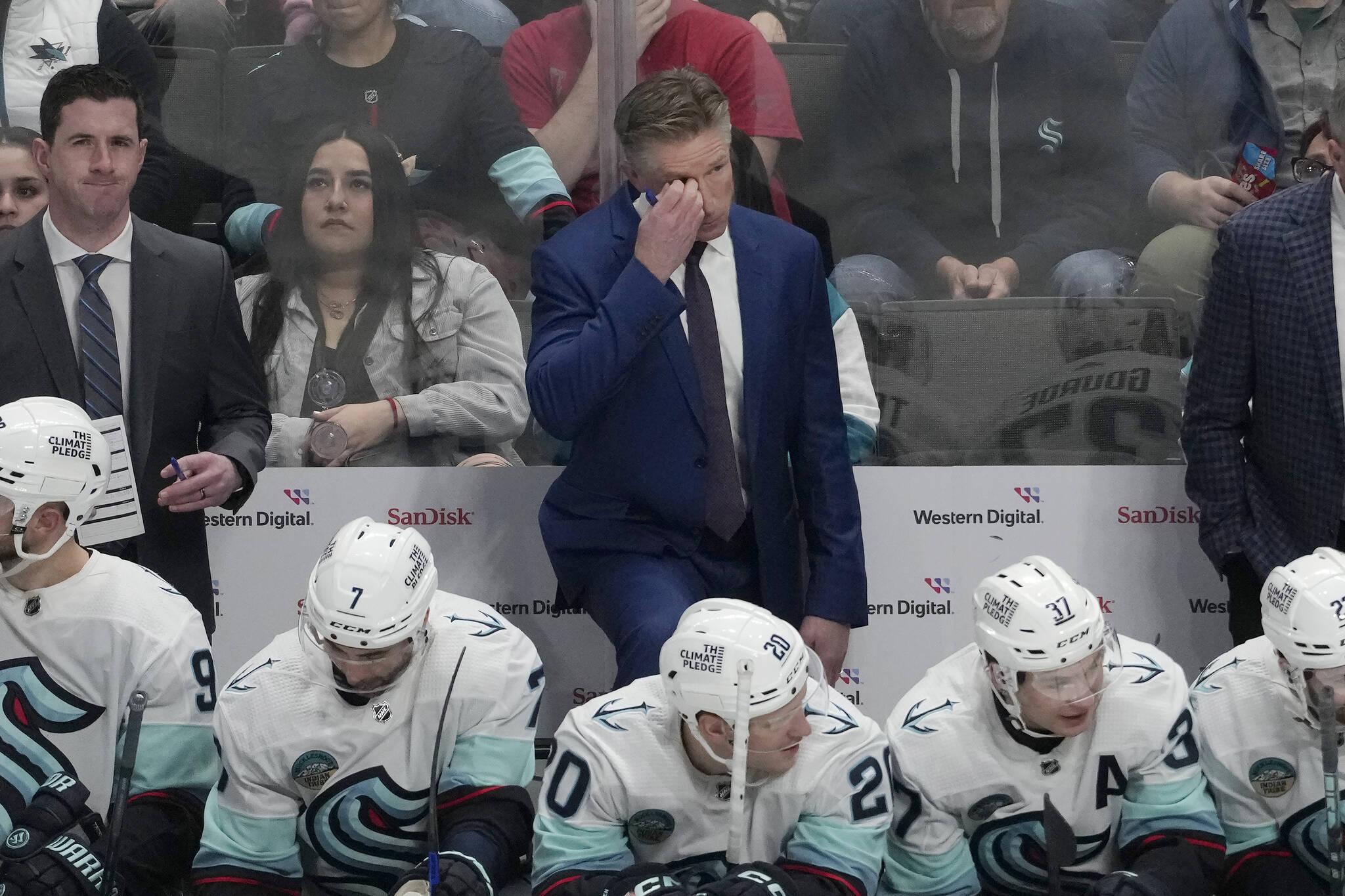FILE - Seattle Kraken head coach Dave Hakstol, top center, reacts on the bench during the third period of an NHL hockey game against the San Jose Sharks in San Jose, Calif., Tuesday, Jan. 30, 2024. The Seattle Kraken fired coach Dave Hakstol on Monday, April 29, 2024, after the third-year franchise took a significant step back following a playoff appearance in their second season. (AP Photo/Jeff Chiu, File)